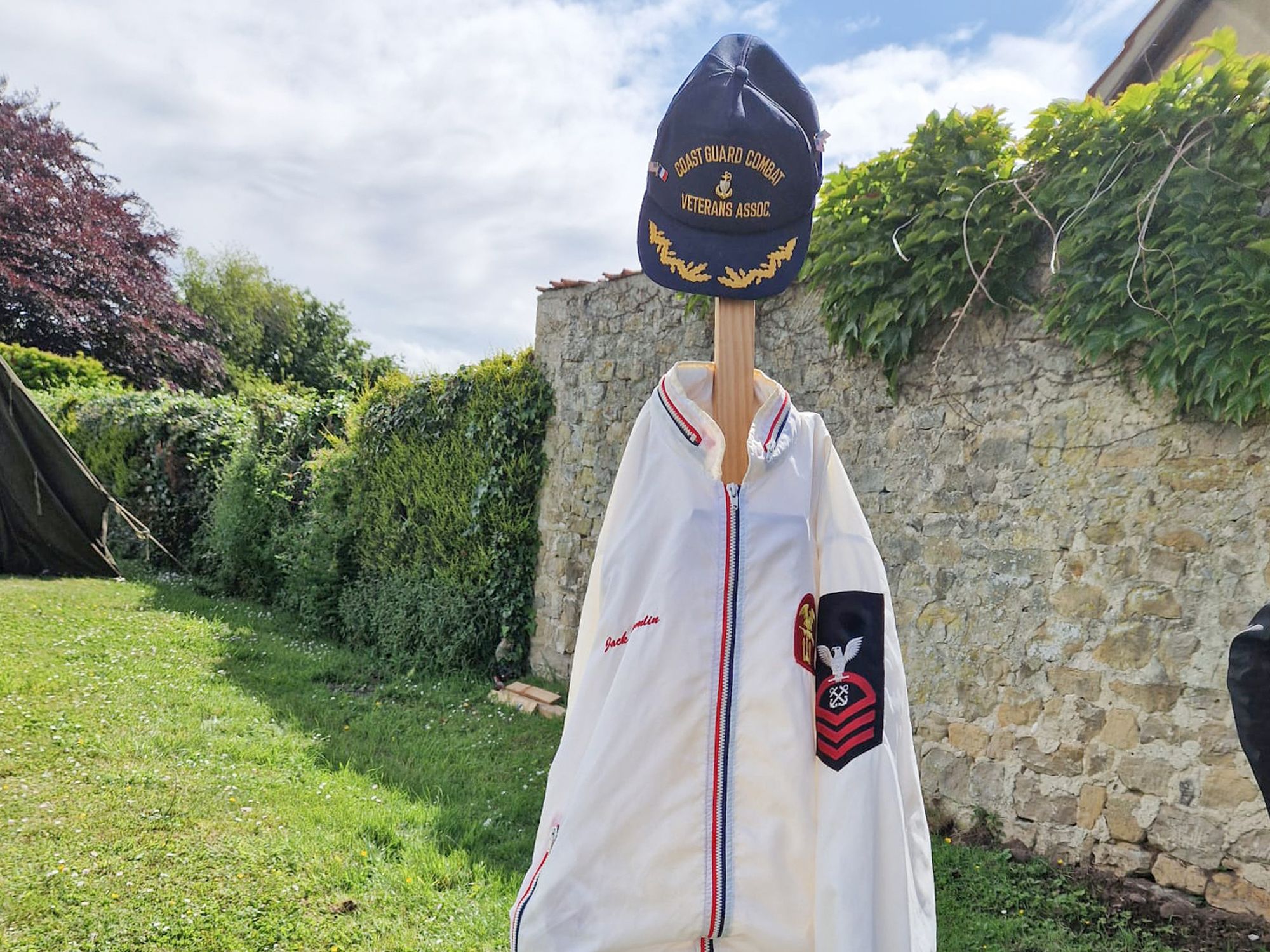 Coast Guard uniform and memorial items honoring Arctic survivors and military service heritage