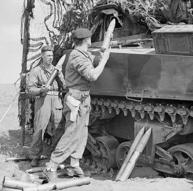 Sherman tanks advancing in offensive operation during WWII military campaign