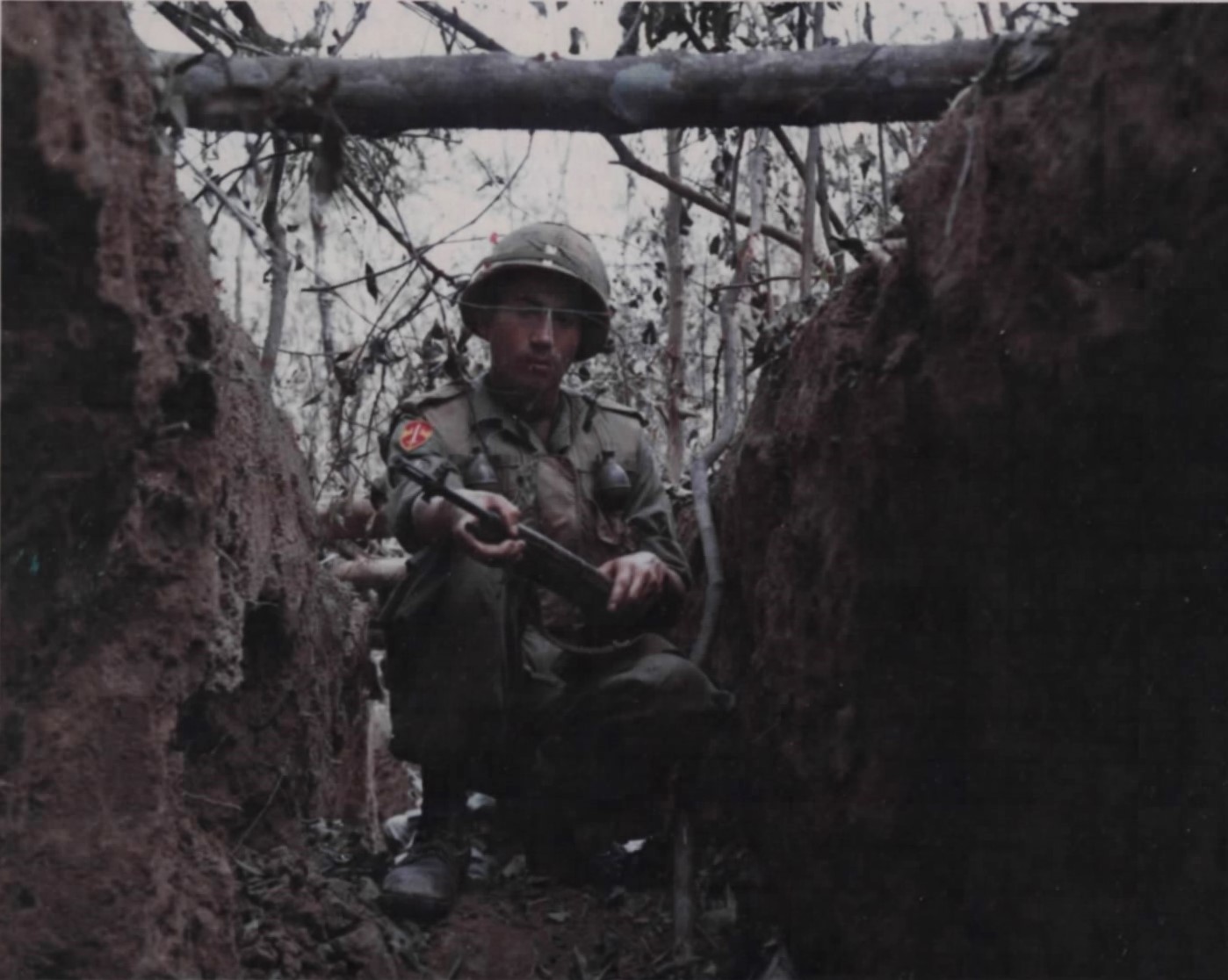 168th Engineer Battalion (combat) soldier searches a VC trench.jpg