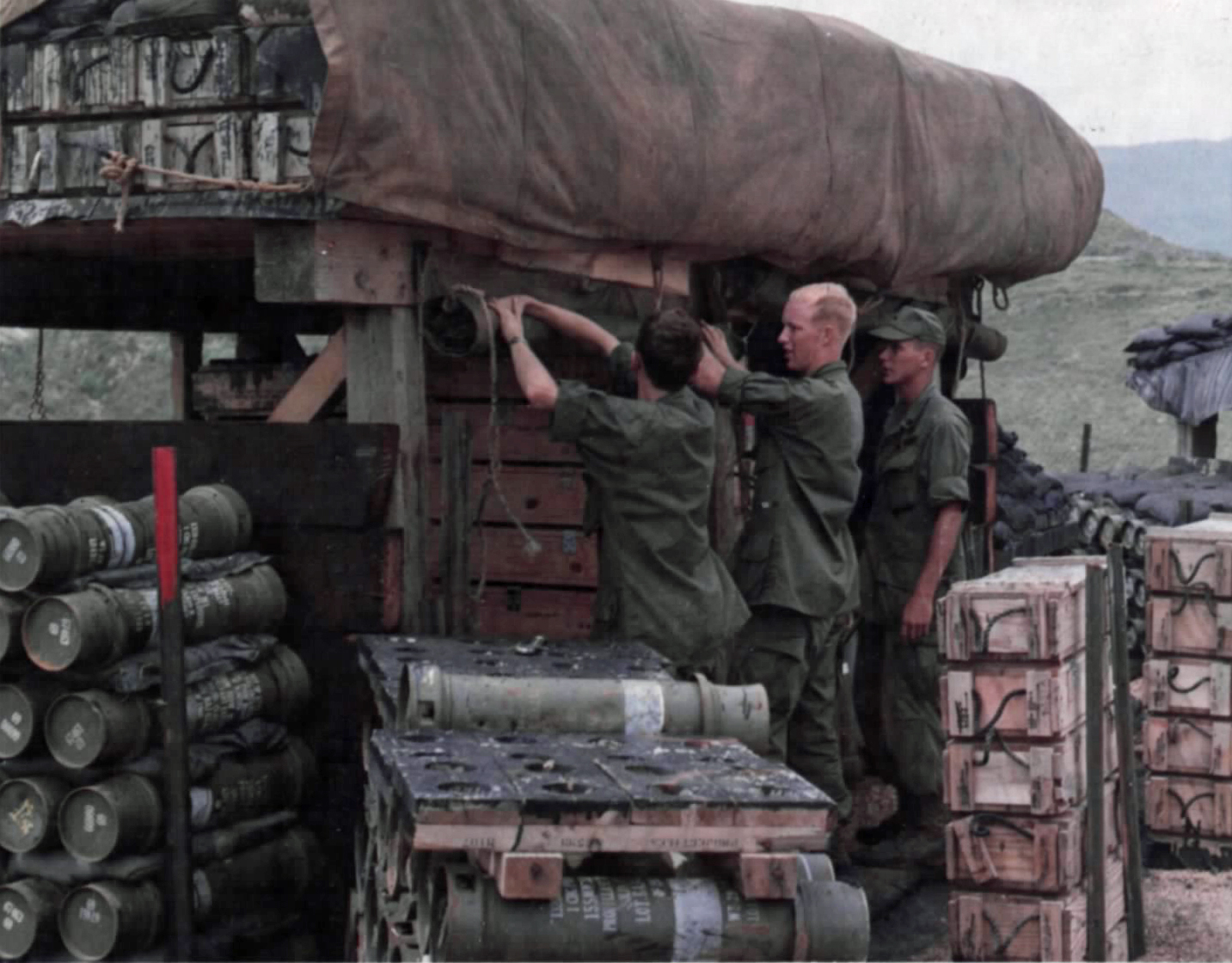 4th Battalion, 21st Infantrymen, tie a canvas cover over artillery rounds at Firebase Debbie.jpg