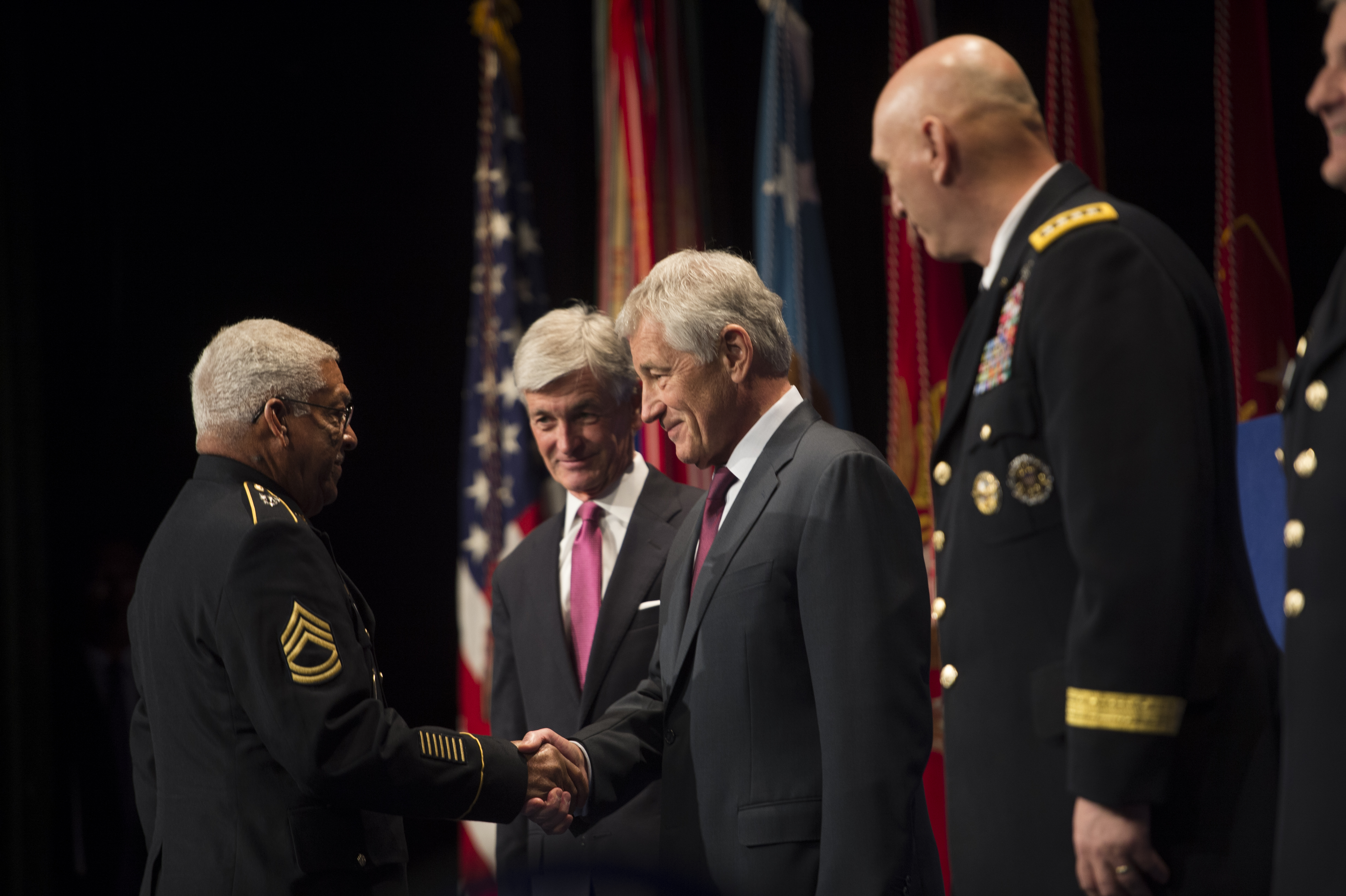 Defense Secretary Chuck Hagel shakes hands with Army Sgt. 1st Class Melvin Morris, one of 24 of the most recent Medal of