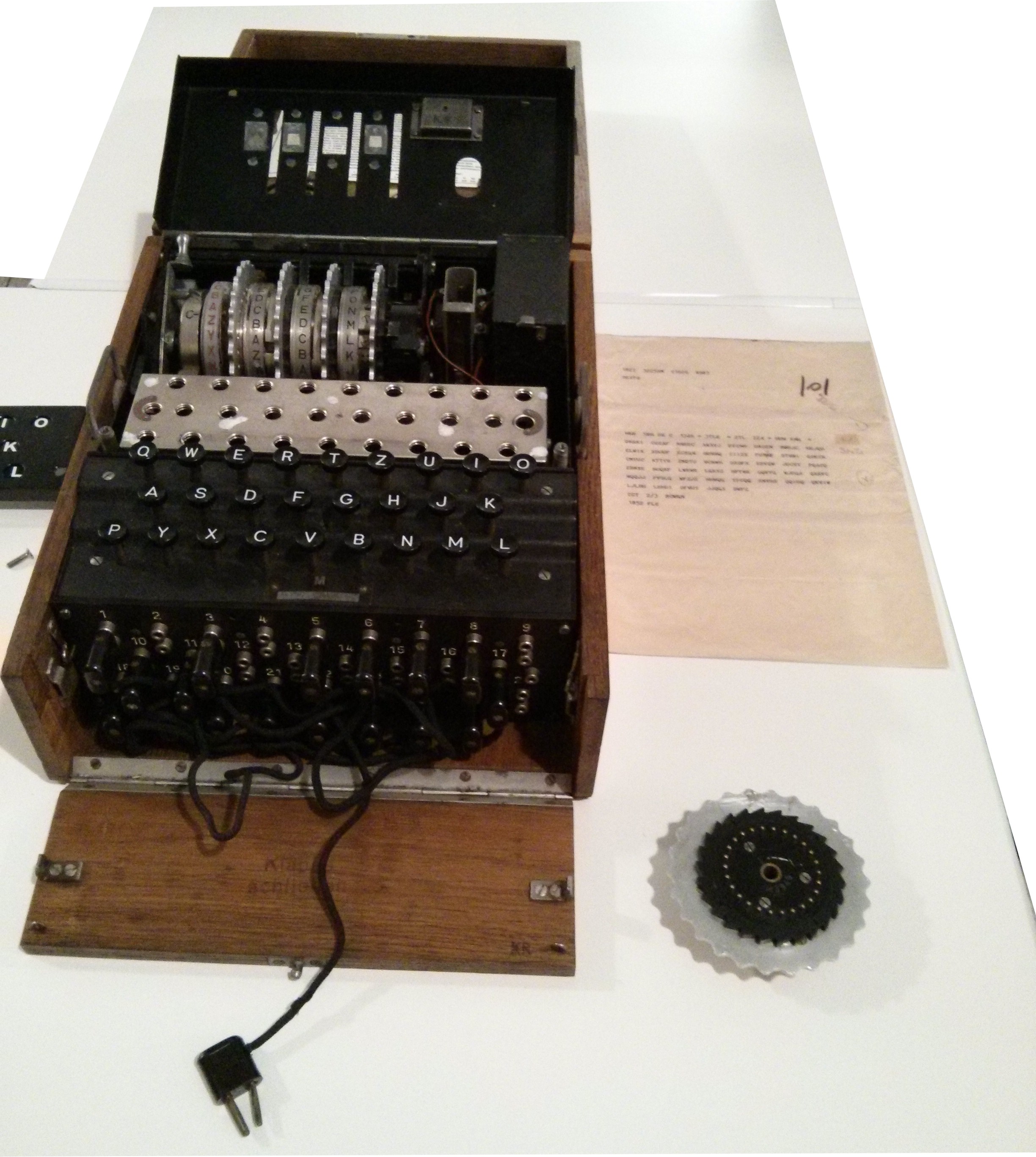 Bletchley Park codebreakers examining Enigma machine intelligence documents during World War II