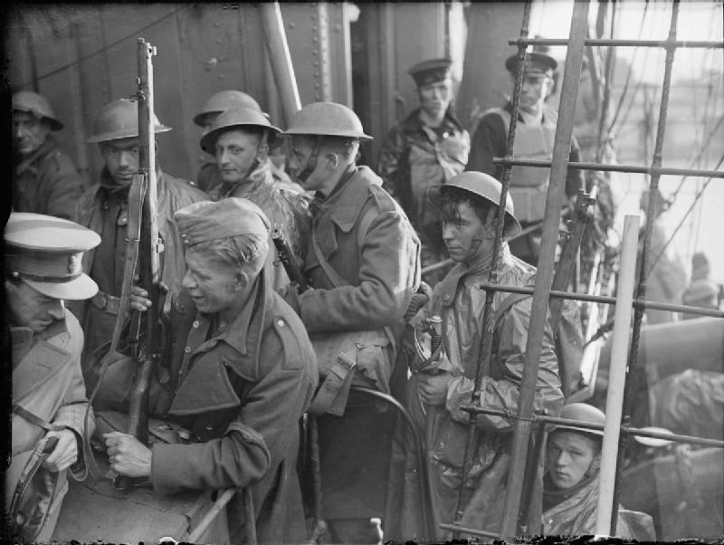 LCVP landing craft disembarking troops during D-Day amphibious assault operations on Normandy beaches.