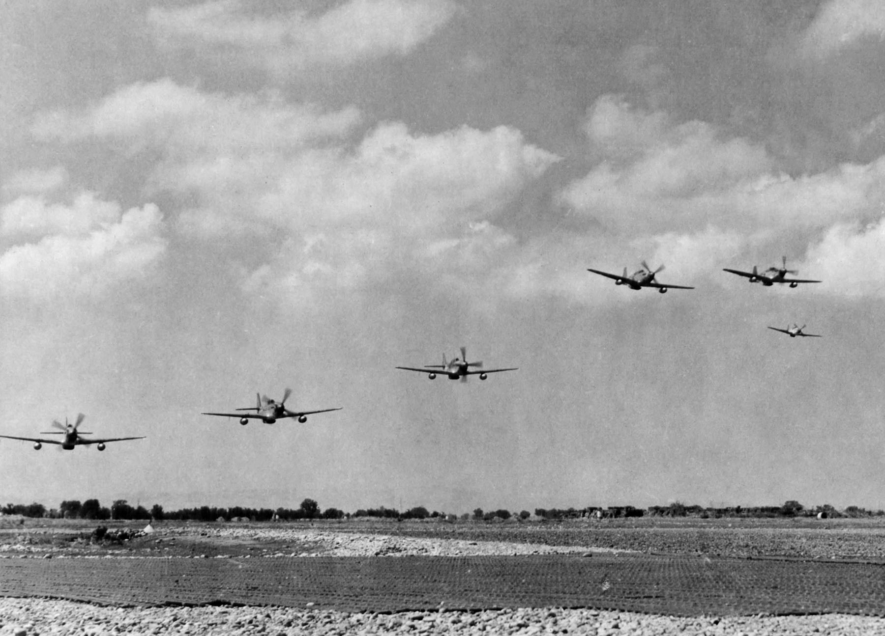 P-51C Mustangs of the 332nd Fighter Group take off in Italy, 1944